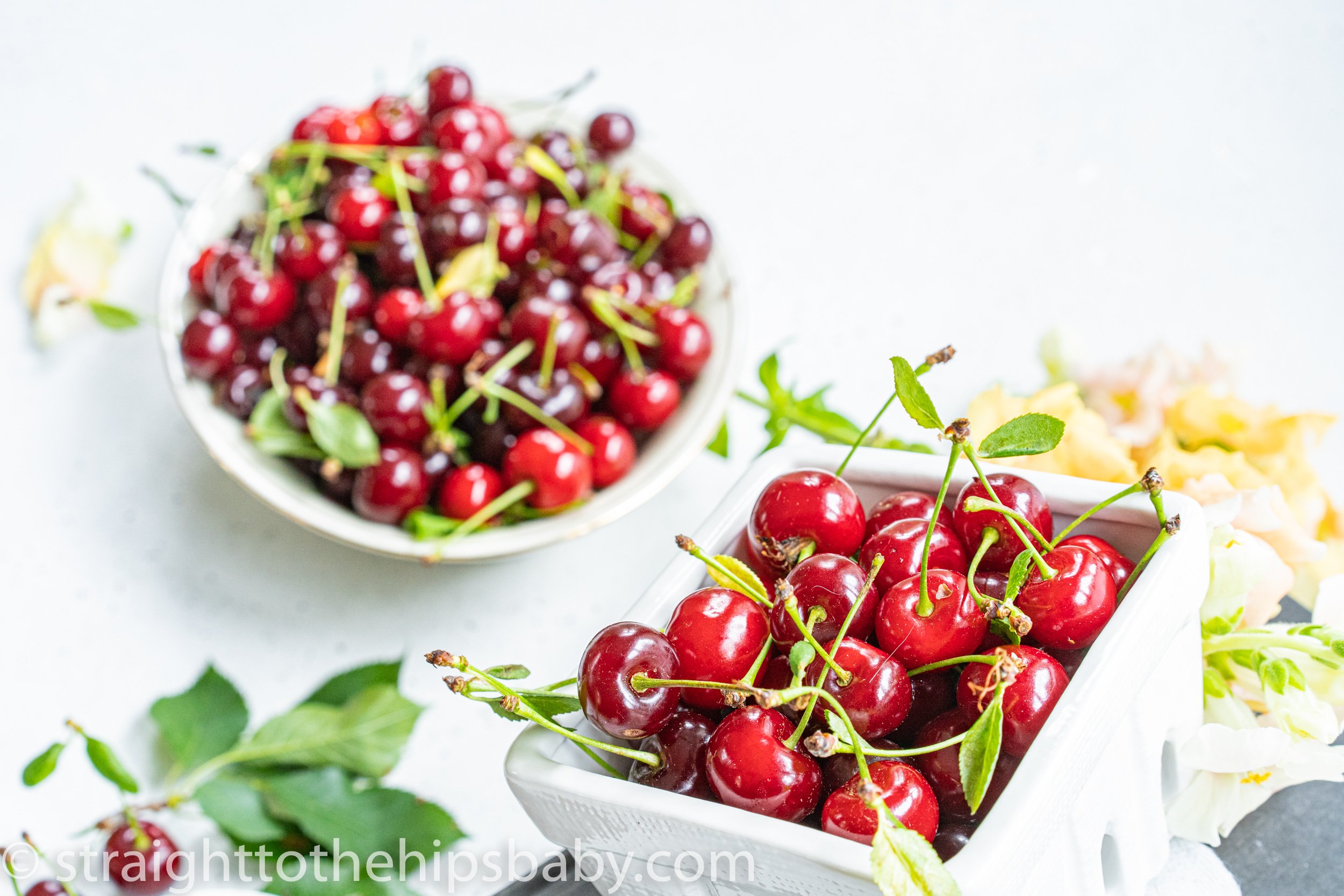 ripe sour cherries in a white container