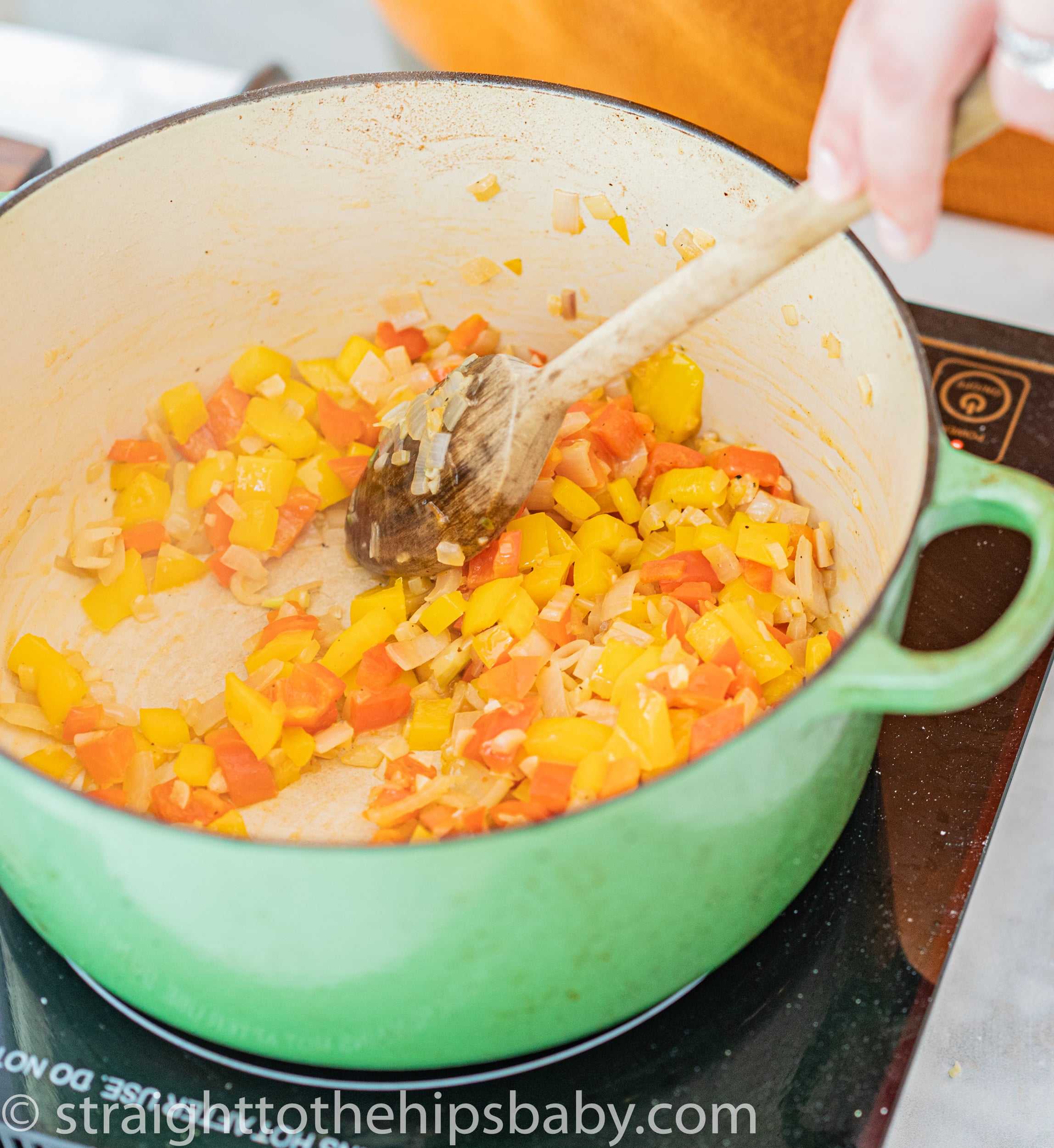 Sautéed bell peppers and shallots for chicken paprikash
