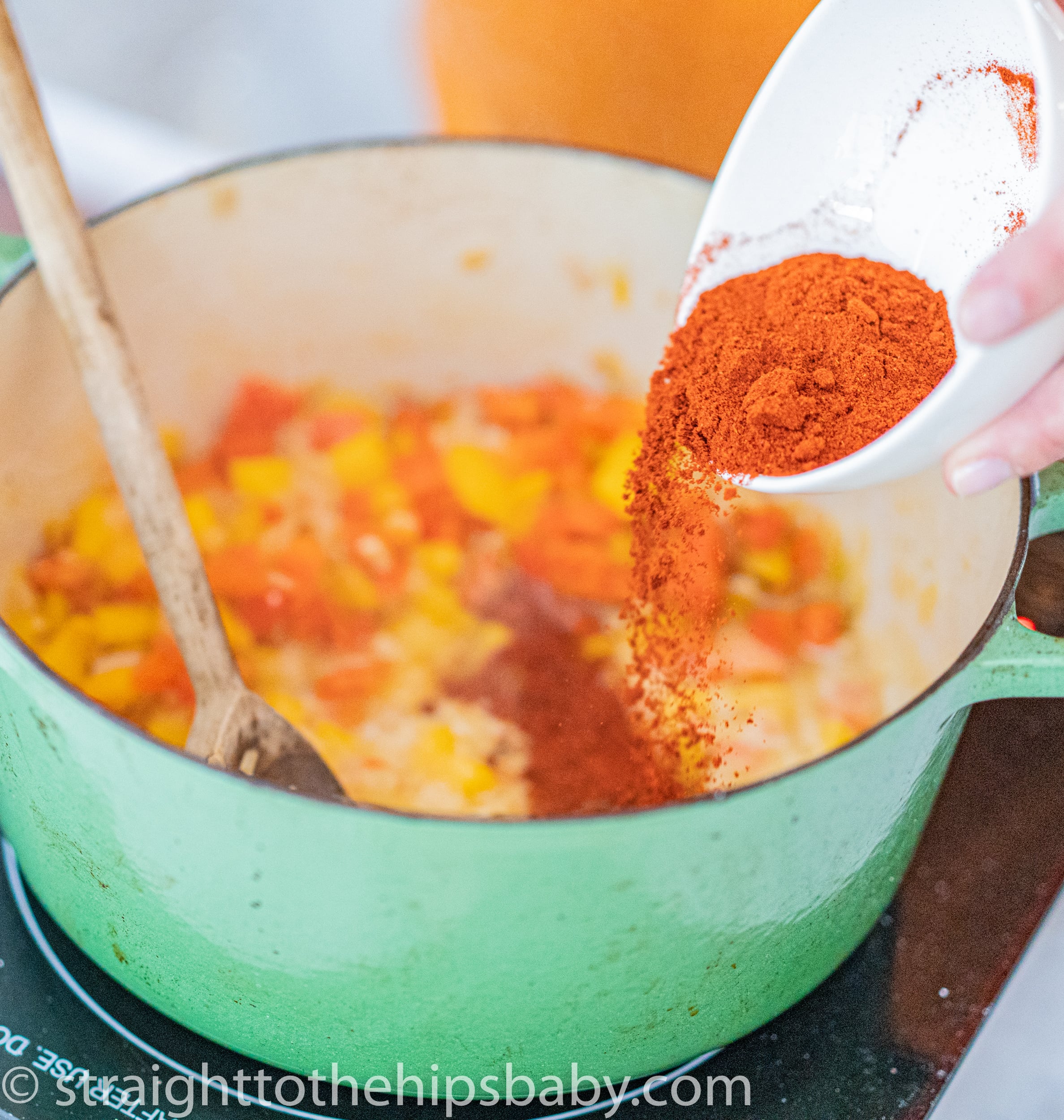 Adding bright red smoked paprika to chicken paprikash sauce